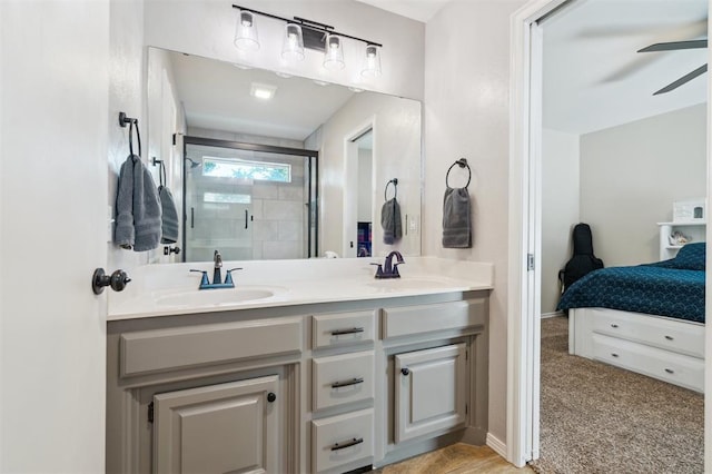 2917 Stafford Rd, Edmond, OK 73012 - ensuite bathroom with a stall shower, double vanity, and a ceiling fan