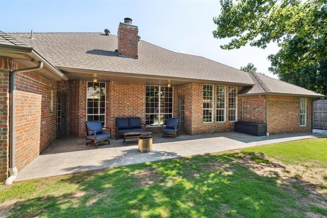 2917 Stafford Rd, Edmond, OK 73012 - back of house with brick siding, a chimney, a patio, and roof with shingles