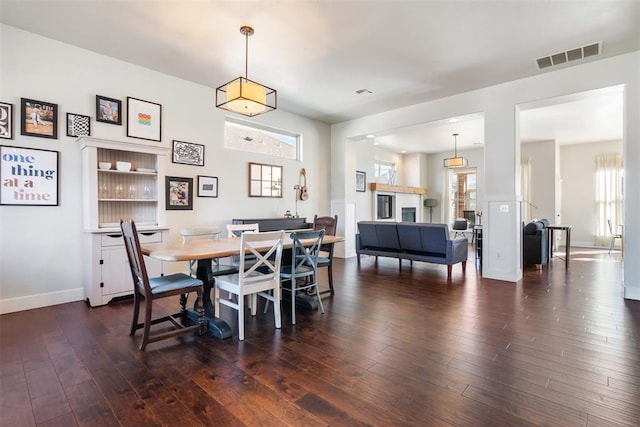 8300 NW 71st St, Oklahoma City, OK 73132 - dining room featuring dark wood-style floors and baseboards