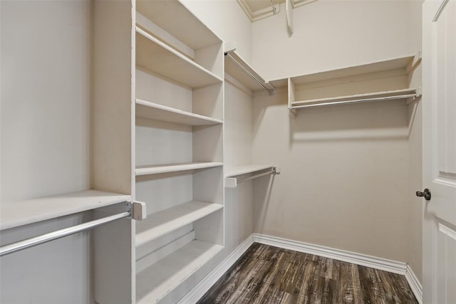 2716 Busheywood Dr, Yukon, OK 73099 - walk in closet featuring dark wood finished floors