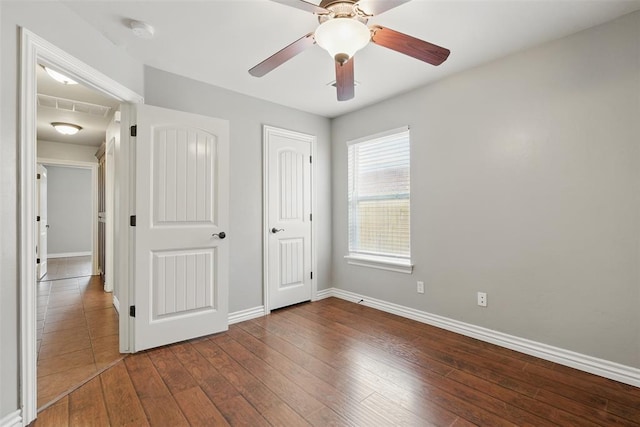 2716 Busheywood Dr, Yukon, OK 73099 - unfurnished bedroom with hardwood / wood-style flooring and ceiling fan