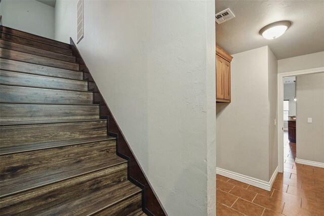 2716 Busheywood Dr, Yukon, OK 73099 - staircase with baseboards and tile patterned floors