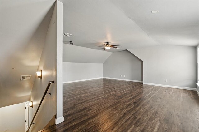 2716 Busheywood Dr, Yukon, OK 73099 - additional living space with vaulted ceiling, a ceiling fan, and dark wood-type flooring
