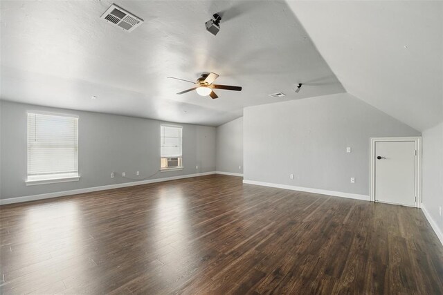 2716 Busheywood Dr, Yukon, OK 73099 - unfurnished living room with ceiling fan, dark wood-type flooring, lofted ceiling, and cooling unit