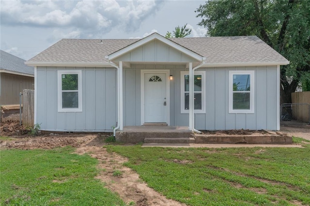 312 SE 45th St, Oklahoma City, OK 73129 - ranch-style house featuring roof with shingles and board and batten siding