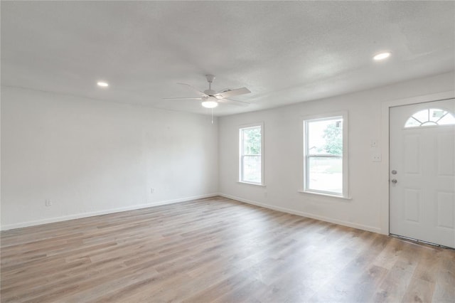 312 SE 45th St, Oklahoma City, OK 73129 - foyer featuring a ceiling fan, light wood finished floors, healthy amount of natural light, recessed lighting, and a textured ceiling