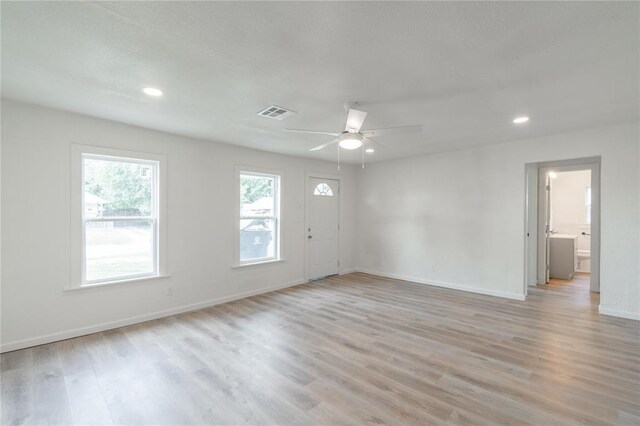 312 SE 45th St, Oklahoma City, OK 73129 - spare room with light wood-style flooring, a ceiling fan, and recessed lighting