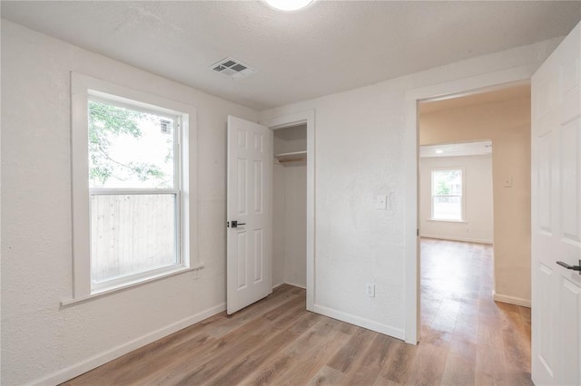 312 SE 45th St, Oklahoma City, OK 73129 - unfurnished bedroom featuring light wood-style flooring and a closet