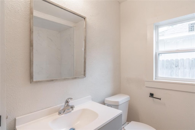 312 SE 45th St, Oklahoma City, OK 73129 - bathroom with vanity and a textured wall