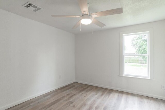312 SE 45th St, Oklahoma City, OK 73129 - spare room featuring light wood-style floors and ceiling fan