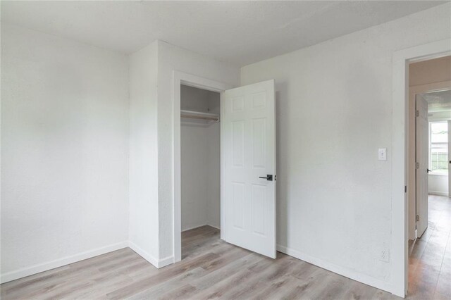 312 SE 45th St, Oklahoma City, OK 73129 - unfurnished bedroom featuring light wood-style flooring and a closet