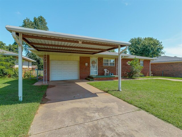 3113 SE 20th St, Oklahoma City, OK 73115 - view of front of house featuring an attached garage, concrete driveway, an attached carport, and brick siding
