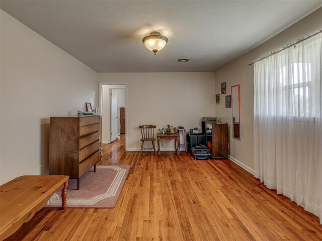 3113 SE 20th St, Oklahoma City, OK 73115 - living area featuring light wood finished floors and baseboards