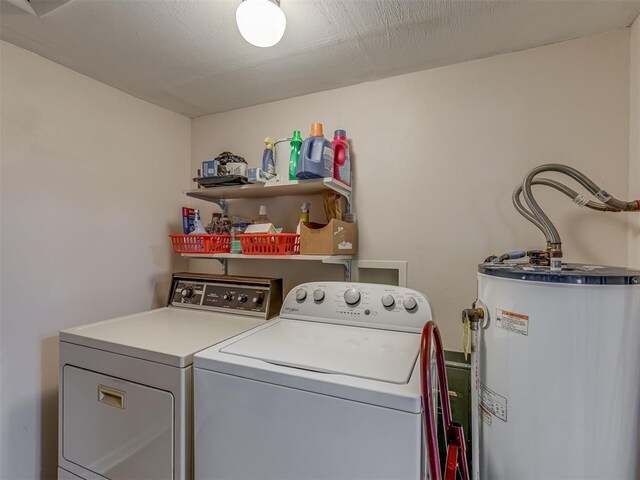 3113 SE 20th St, Oklahoma City, OK 73115 - laundry room featuring water heater and washer and dryer