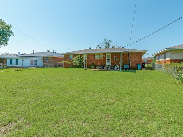 3113 SE 20th St, Oklahoma City, OK 73115 - rear view of house with a fenced backyard