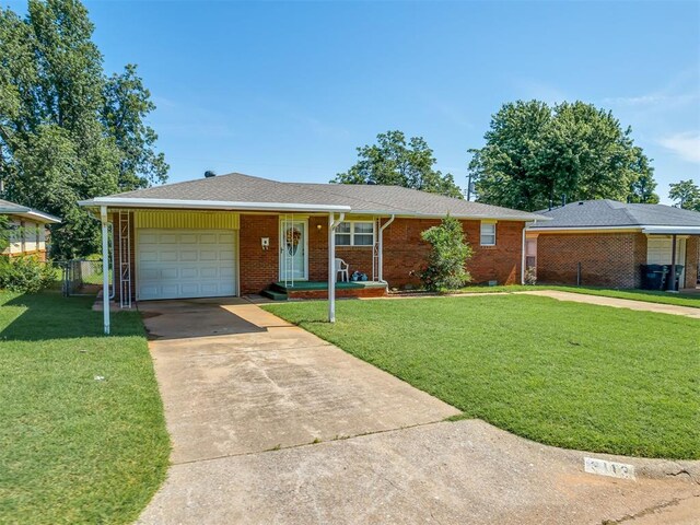 3113 SE 20th St, Oklahoma City, OK 73115 - single story home with a garage, concrete driveway, and brick siding