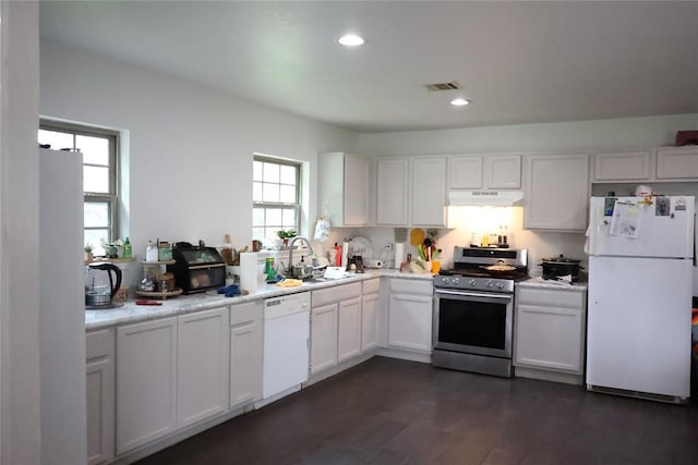 12693 258th St, Blanchard, OK 73010 - kitchen with white appliances, under cabinet range hood, light countertops, white cabinetry, and recessed lighting