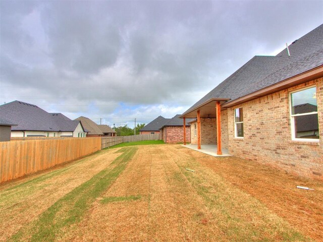9320 NW 84th St, Yukon, OK 73099 - fenced backyard with a patio