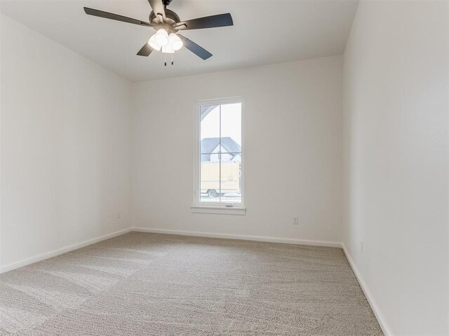 9320 NW 84th St, Yukon, OK 73099 - carpeted spare room with ceiling fan and baseboards