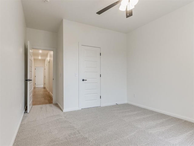 9320 NW 84th St, Yukon, OK 73099 - unfurnished bedroom with light carpet and ceiling fan