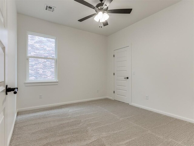 9320 NW 84th St, Yukon, OK 73099 - unfurnished room with light colored carpet and ceiling fan