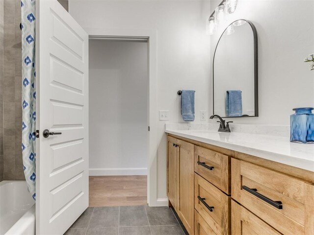 9320 NW 84th St, Yukon, OK 73099 - bathroom featuring vanity, shower / bath combo with shower curtain, and tile patterned floors
