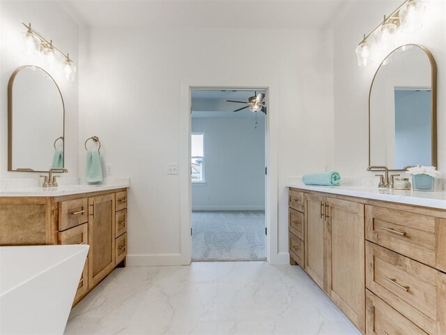 9320 NW 84th St, Yukon, OK 73099 - bathroom featuring marble look tiles, two vanities, and a soaking tub