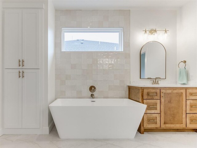 9320 NW 84th St, Yukon, OK 73099 - full bathroom featuring a freestanding tub, vanity, and marble finish floors