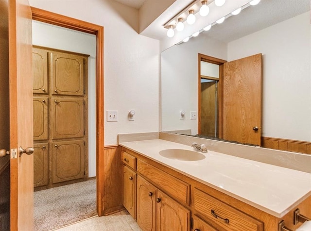 302 W Branches Way, Mustang, OK 73064 - bathroom featuring vanity and wainscoting