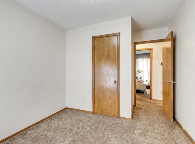 302 W Branches Way, Mustang, OK 73064 - unfurnished bedroom with light colored carpet and baseboards