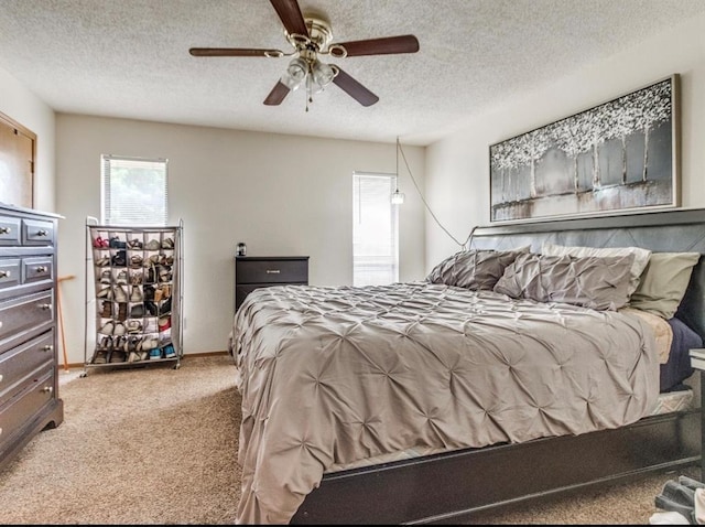 302 W Branches Way, Mustang, OK 73064 - carpeted bedroom featuring a textured ceiling and ceiling fan