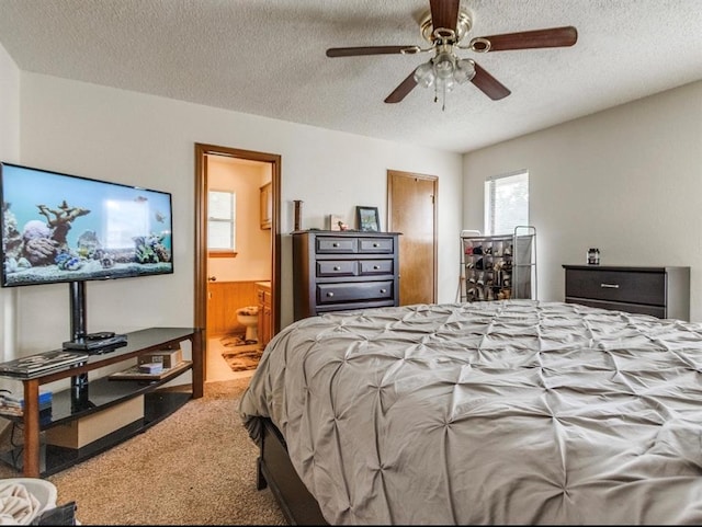 302 W Branches Way, Mustang, OK 73064 - carpeted bedroom with a textured ceiling, ensuite bath, and ceiling fan