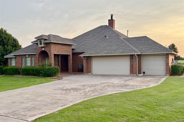 20301 Flowered Meadows Way, Edmond, OK 73012 - view of front of home with a garage, roof with shingles, brick siding, and driveway