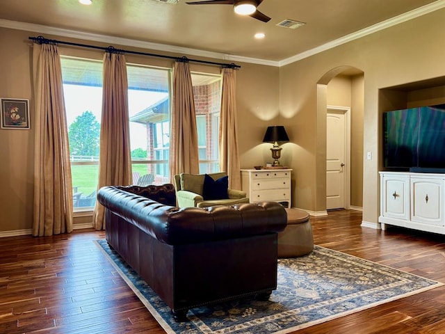 20301 Flowered Meadows Way, Edmond, OK 73012 - living room with dark wood finished floors, a ceiling fan, crown molding, arched walkways, and recessed lighting