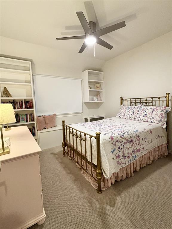 20301 Flowered Meadows Way, Edmond, OK 73012 - carpeted bedroom featuring a ceiling fan
