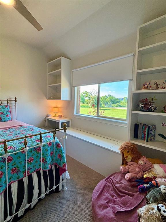 20301 Flowered Meadows Way, Edmond, OK 73012 - carpeted bedroom featuring ceiling fan