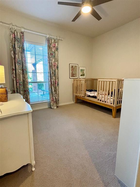 20301 Flowered Meadows Way, Edmond, OK 73012 - bedroom featuring carpet and ceiling fan
