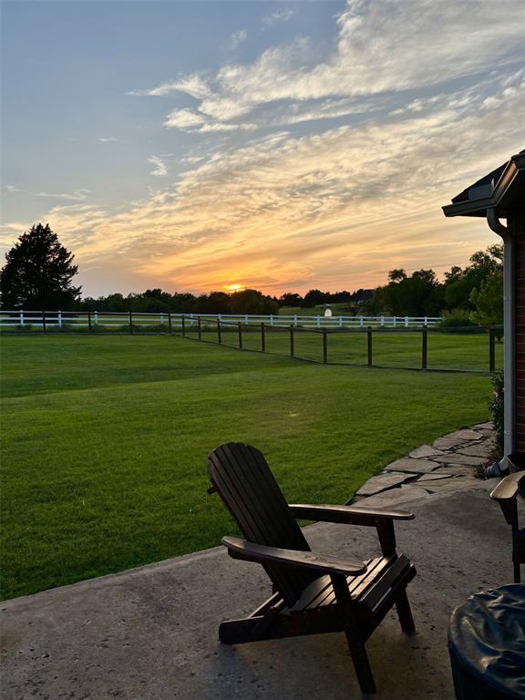 20301 Flowered Meadows Way, Edmond, OK 73012 - yard at dusk featuring a rural view