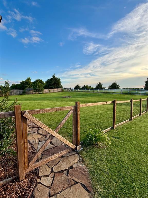 20301 Flowered Meadows Way, Edmond, OK 73012 - gate with a view of rural / pastoral area
