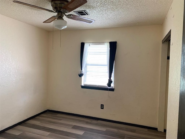 516 Ridgecrest Rd, Edmond, OK 73013 - empty room featuring wood finished floors, ceiling fan, and a textured ceiling
