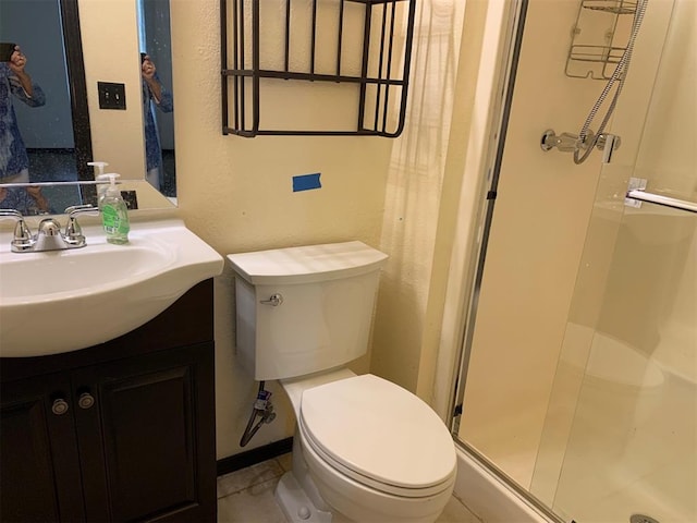 516 Ridgecrest Rd, Edmond, OK 73013 - bathroom with a shower stall, vanity, and a textured wall