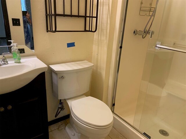 516 Ridgecrest Rd, Edmond, OK 73013 - bathroom featuring a shower stall, vanity, and tile patterned flooring