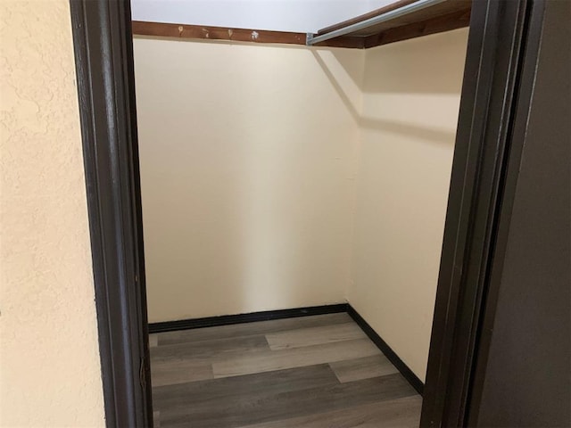 516 Ridgecrest Rd, Edmond, OK 73013 - spacious closet with wood finished floors