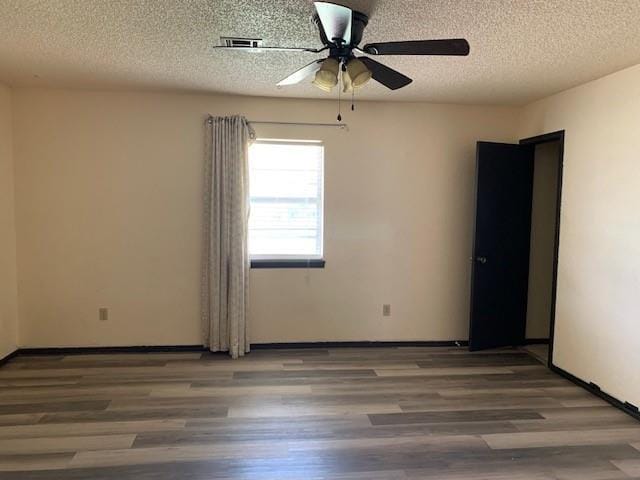 516 Ridgecrest Rd, Edmond, OK 73013 - spare room featuring ceiling fan, a textured ceiling, and wood finished floors