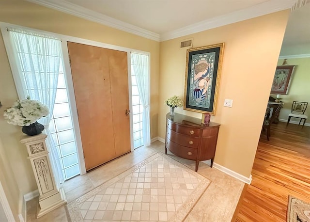 1516 N Hudson St, Altus, OK 73521 - entrance foyer with crown molding and light wood-style flooring