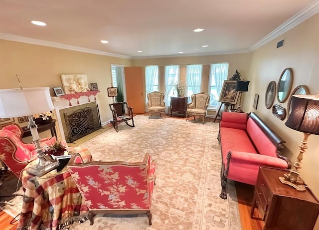 1516 N Hudson St, Altus, OK 73521 - living room featuring a fireplace, ornamental molding, wood finished floors, and recessed lighting