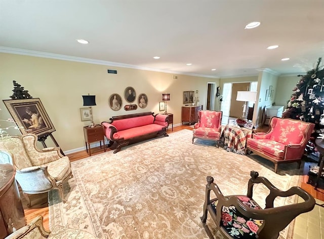 1516 N Hudson St, Altus, OK 73521 - living area featuring crown molding, recessed lighting, and wood finished floors