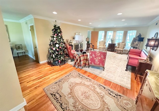 1516 N Hudson St, Altus, OK 73521 - living room with wood finished floors, crown molding, and recessed lighting