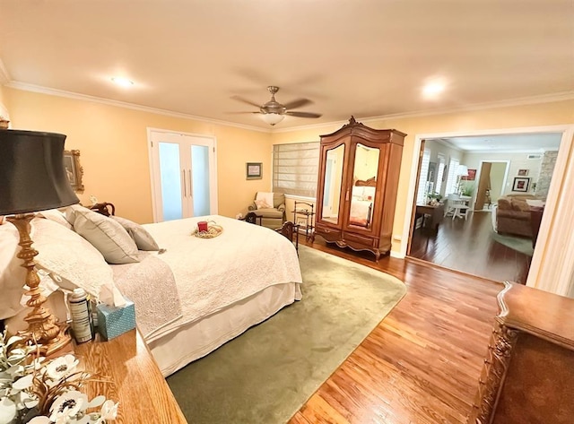 1516 N Hudson St, Altus, OK 73521 - bedroom with wood finished floors, crown molding, and a ceiling fan