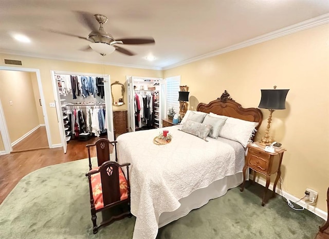 1516 N Hudson St, Altus, OK 73521 - bedroom featuring crown molding, a ceiling fan, and multiple closets